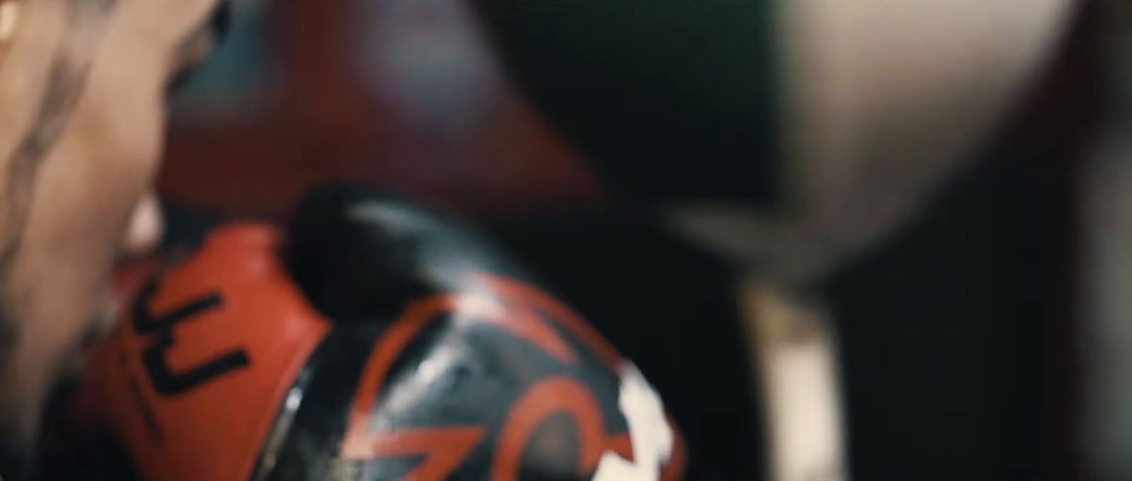 a close up of a football helmet with a blurry background