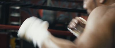 a blurry photo of a man in a boxing ring