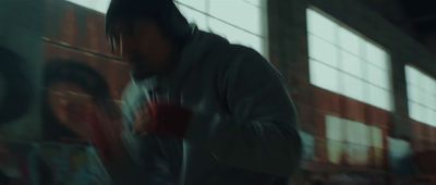 a blurry photo of a man in a hoodie