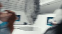 a blurry photo of a person standing in a bathroom