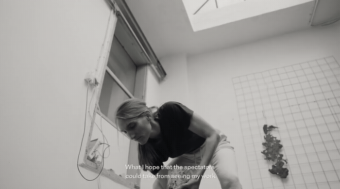 a woman bending over in a bath room