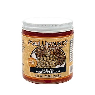 a jar of pineapple jam on a white background