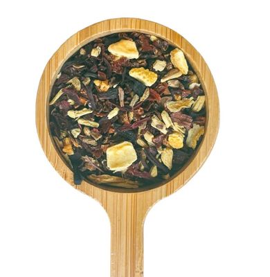 a wooden spoon filled with a mixture of fruit and nuts