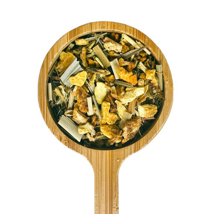 a close up of a wooden spoon with food in it