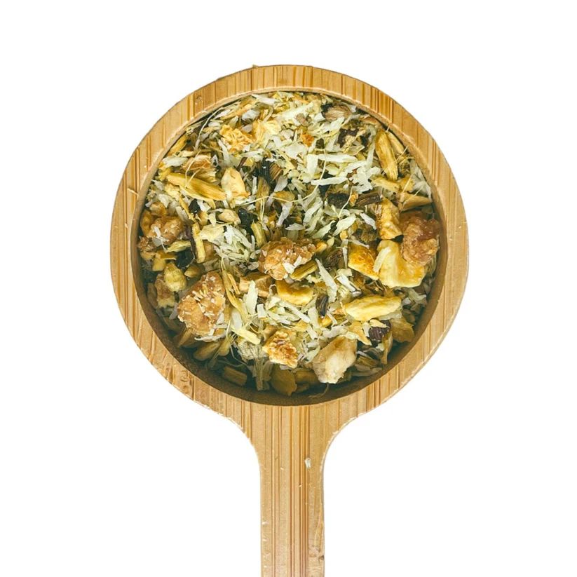 a wooden spoon with food inside of it