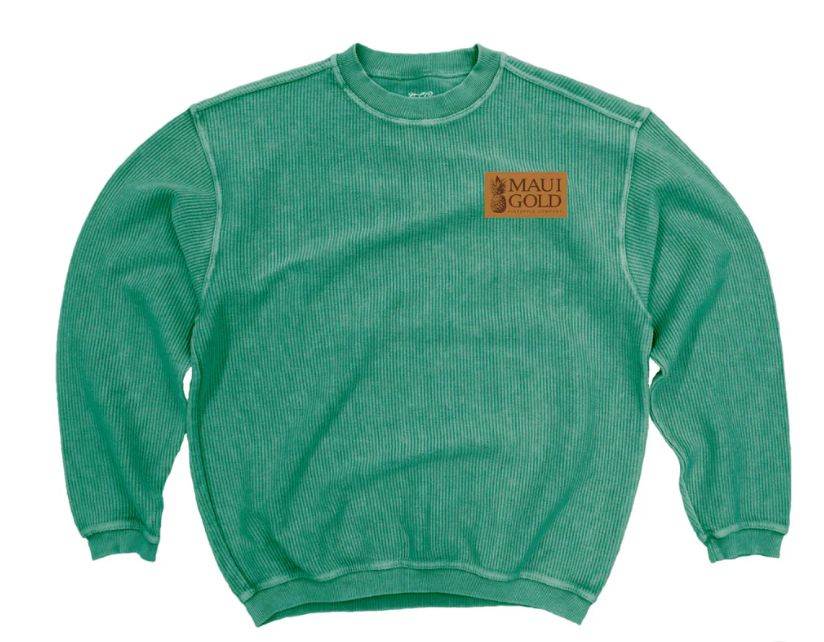 a green sweatshirt with a brown patch on the chest