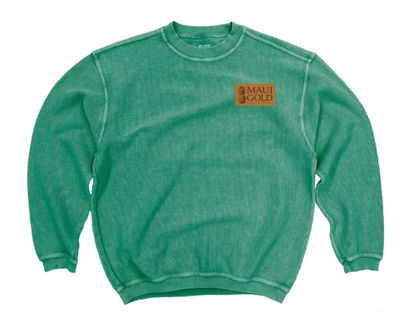 a green sweatshirt with a brown patch on the chest