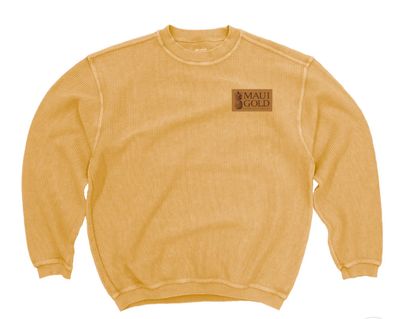 a yellow sweater with a brown patch on the chest