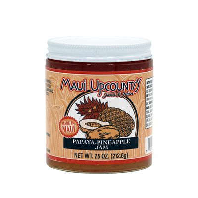 a jar of papaya pineapple jam on a white background