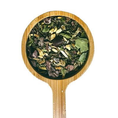 a close up of a wooden spoon with a salad in it