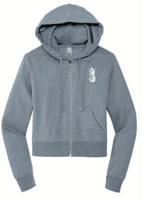 a women's sweatshirt with a pineapple embroidered on the front