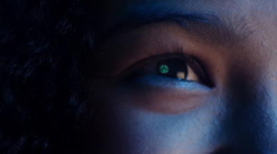 a close up of a person's green eye