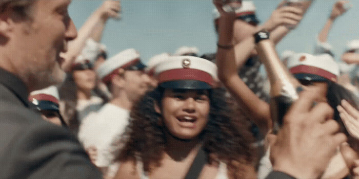 a group of cheerleaders holding their hands in the air