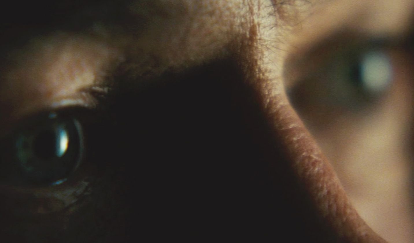 a close up of a person's eye with a blurry background