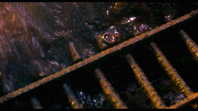 a close up of a metal grate on a grill