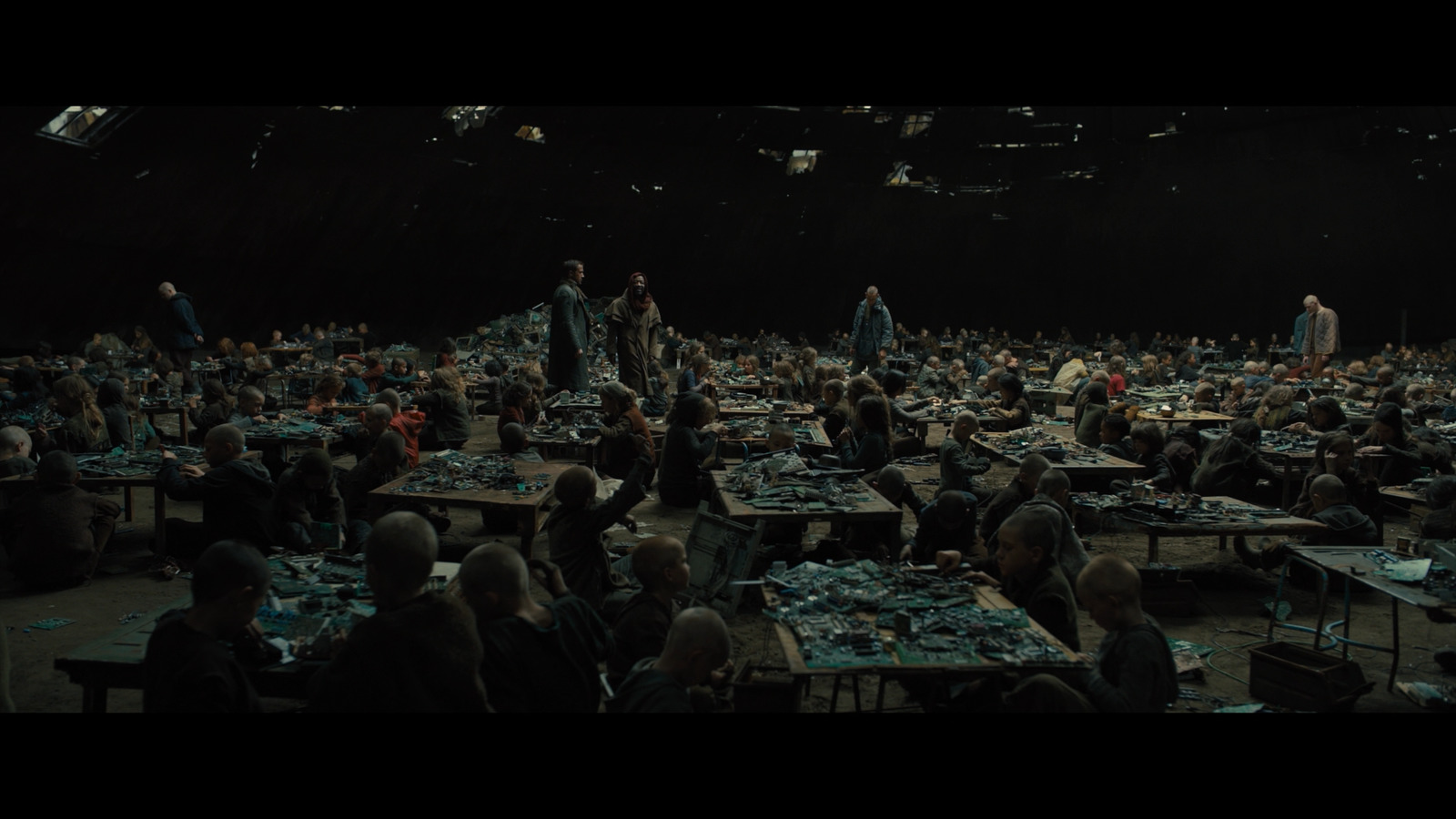 a large group of people sitting at tables