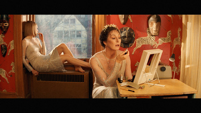 a woman sitting at a desk in front of a computer