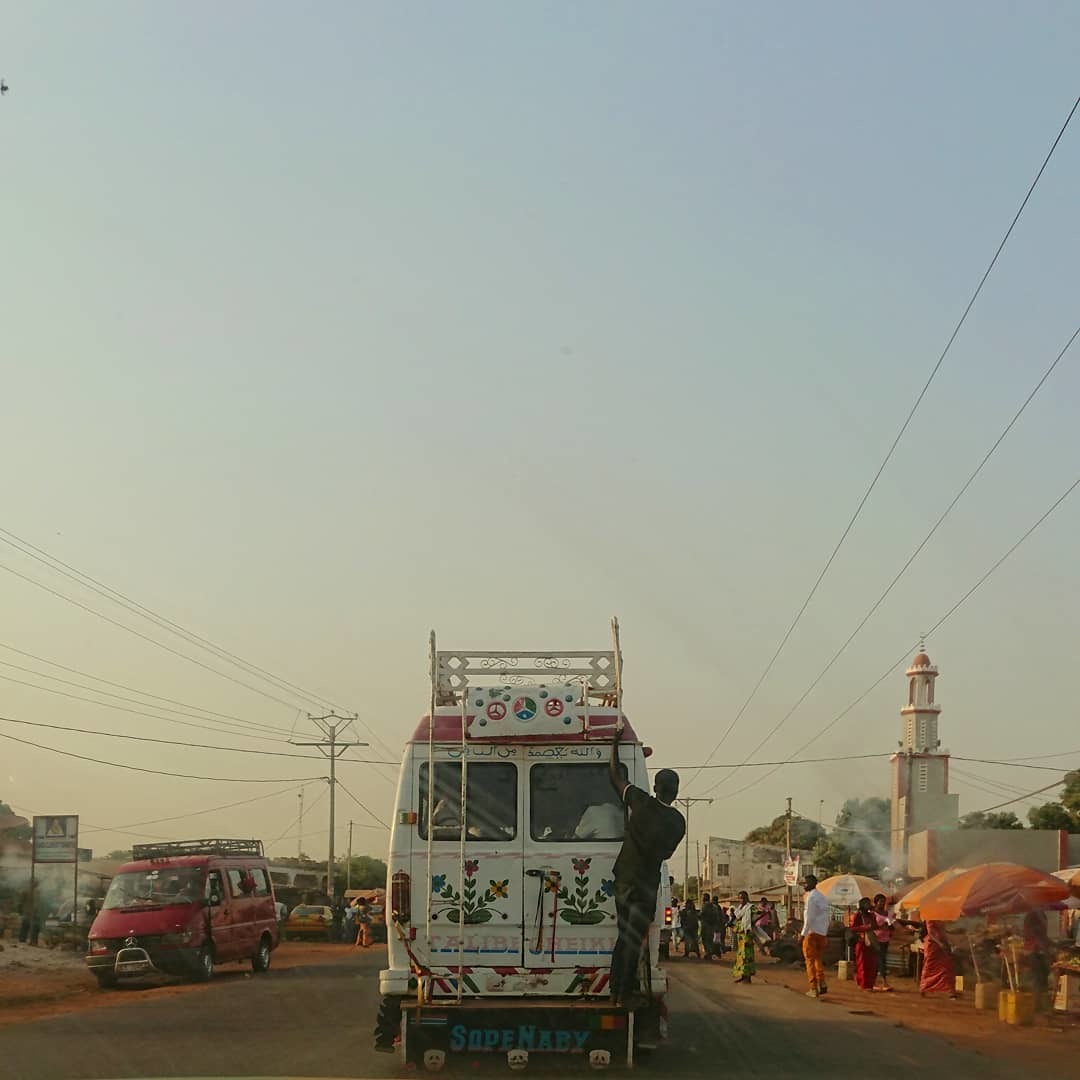 a man standing on the back of a truck