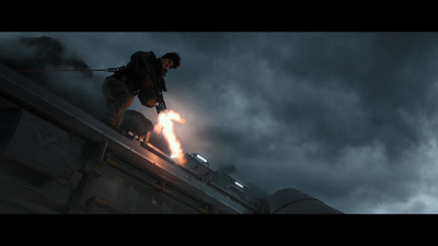 a man standing on top of a metal roof