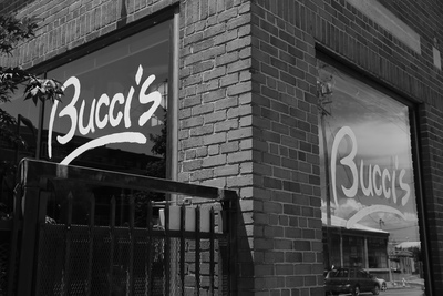 a black and white photo of a bucco's restaurant