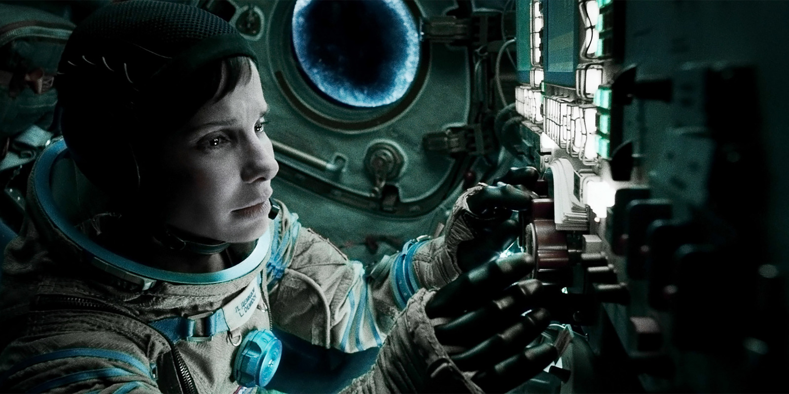 a woman in a space suit holding a machine