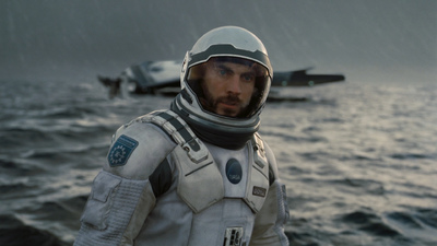 a man in a space suit standing on a boat