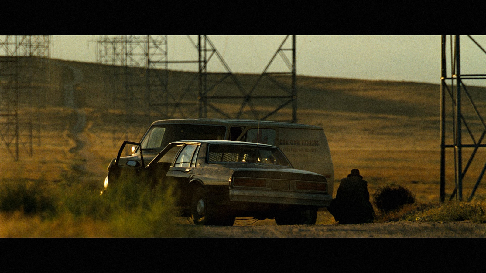 a truck and a person on a dirt road