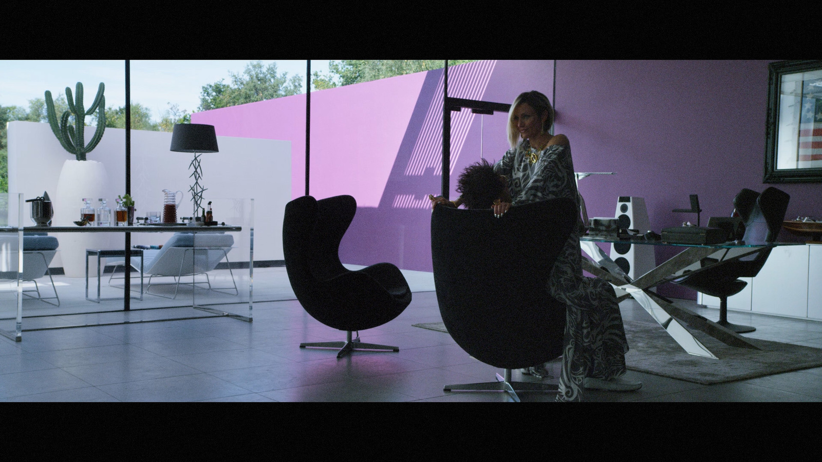 a woman sitting in a chair in a room