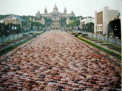 a large group of people laying in the middle of a road