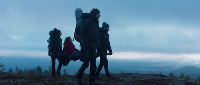 a group of people standing on top of a mountain