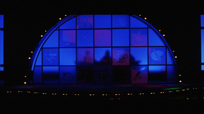 a stage set with blue lights and windows