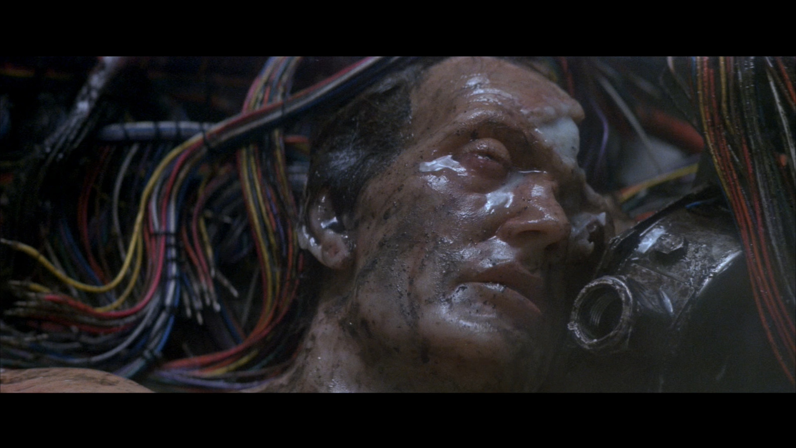 a man with a lot of wires all over his face