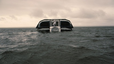 a boat floating on top of a large body of water