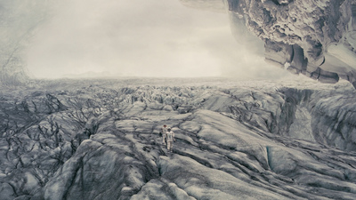 a group of people standing on top of a glacier