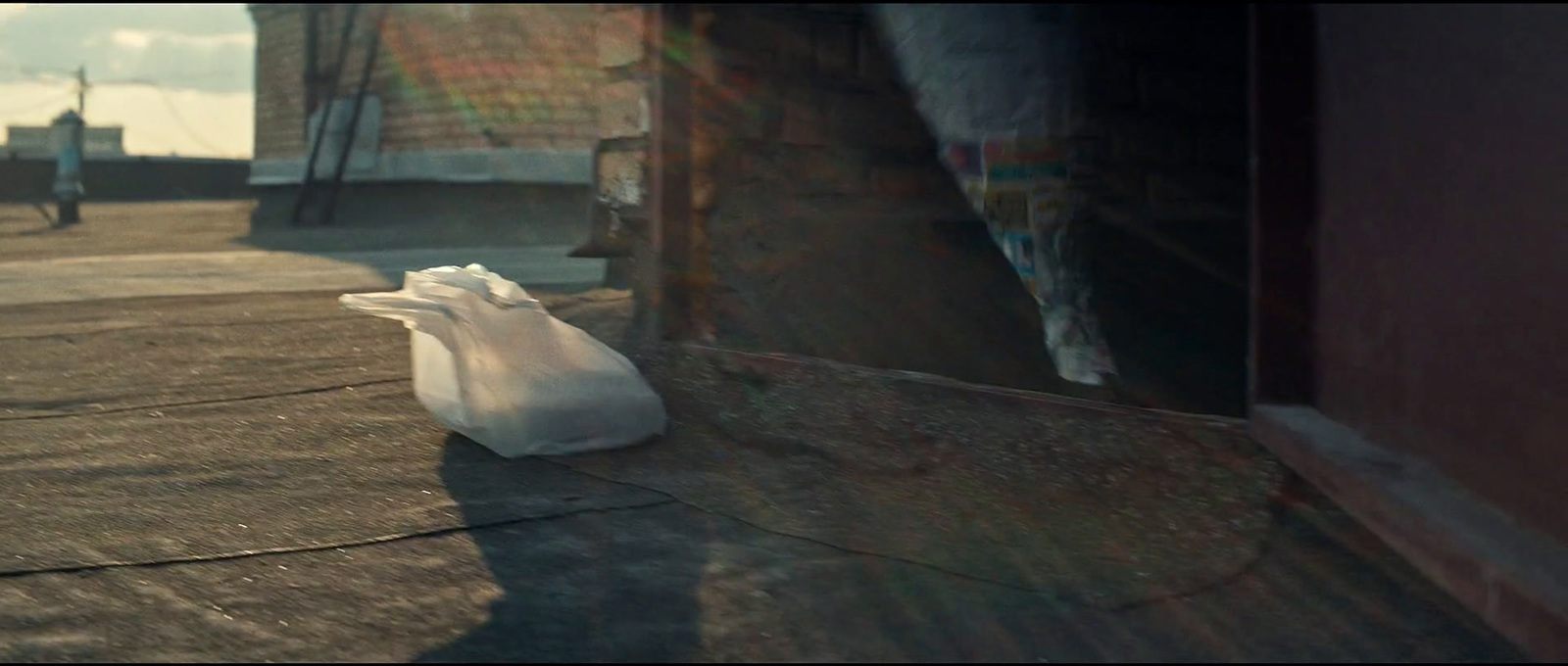 a white plastic bag sitting on top of a roof