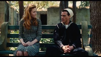 a man and a woman sitting on a bench