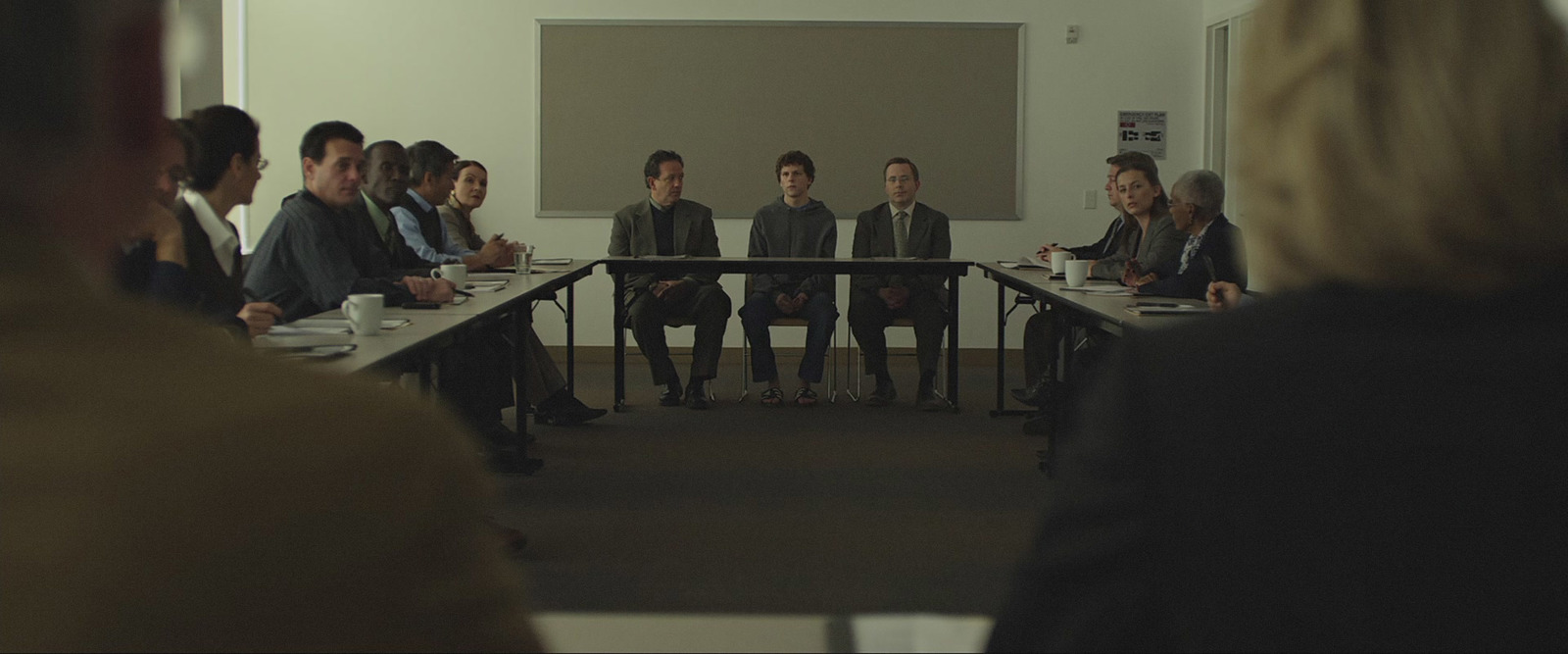 a group of people sitting around a table