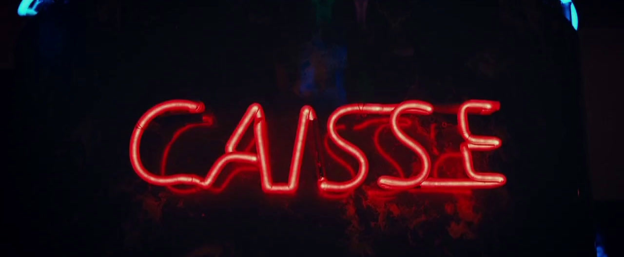 a close up of a neon sign in the dark