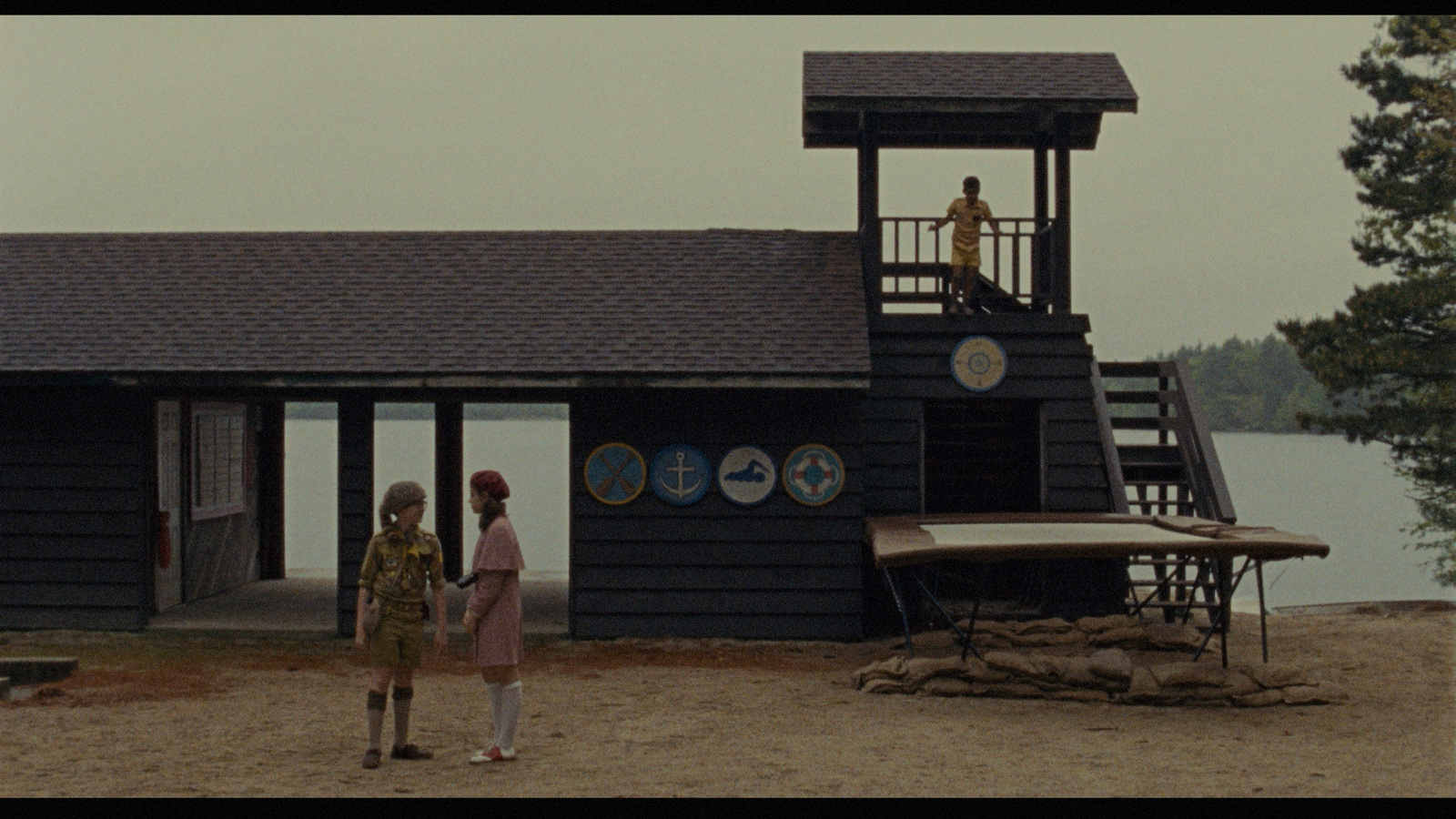 a couple of people standing in front of a building