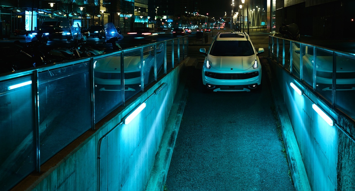 a car parked on the side of a road at night