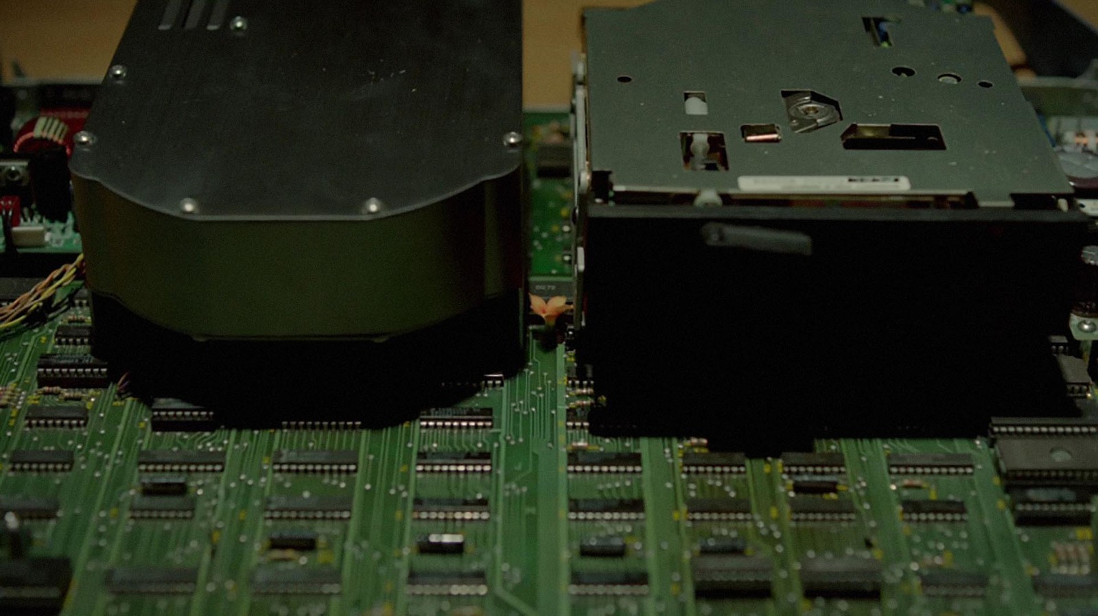 a close up of two electronic components on a board