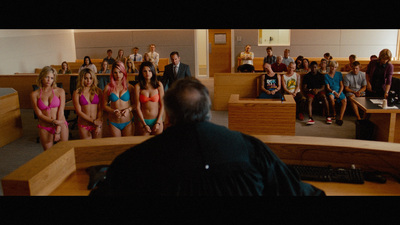 a group of people in bikinis in a courtroom