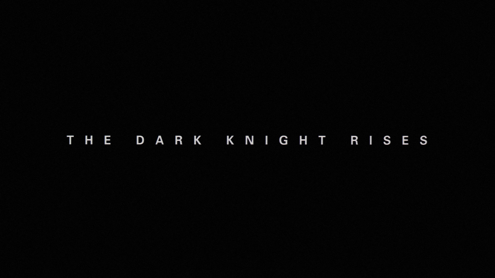 a black background with the words the dark knight rises