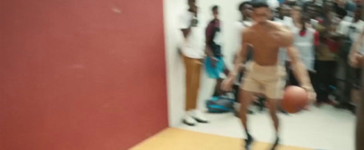 a blurry photo of a man holding a basketball