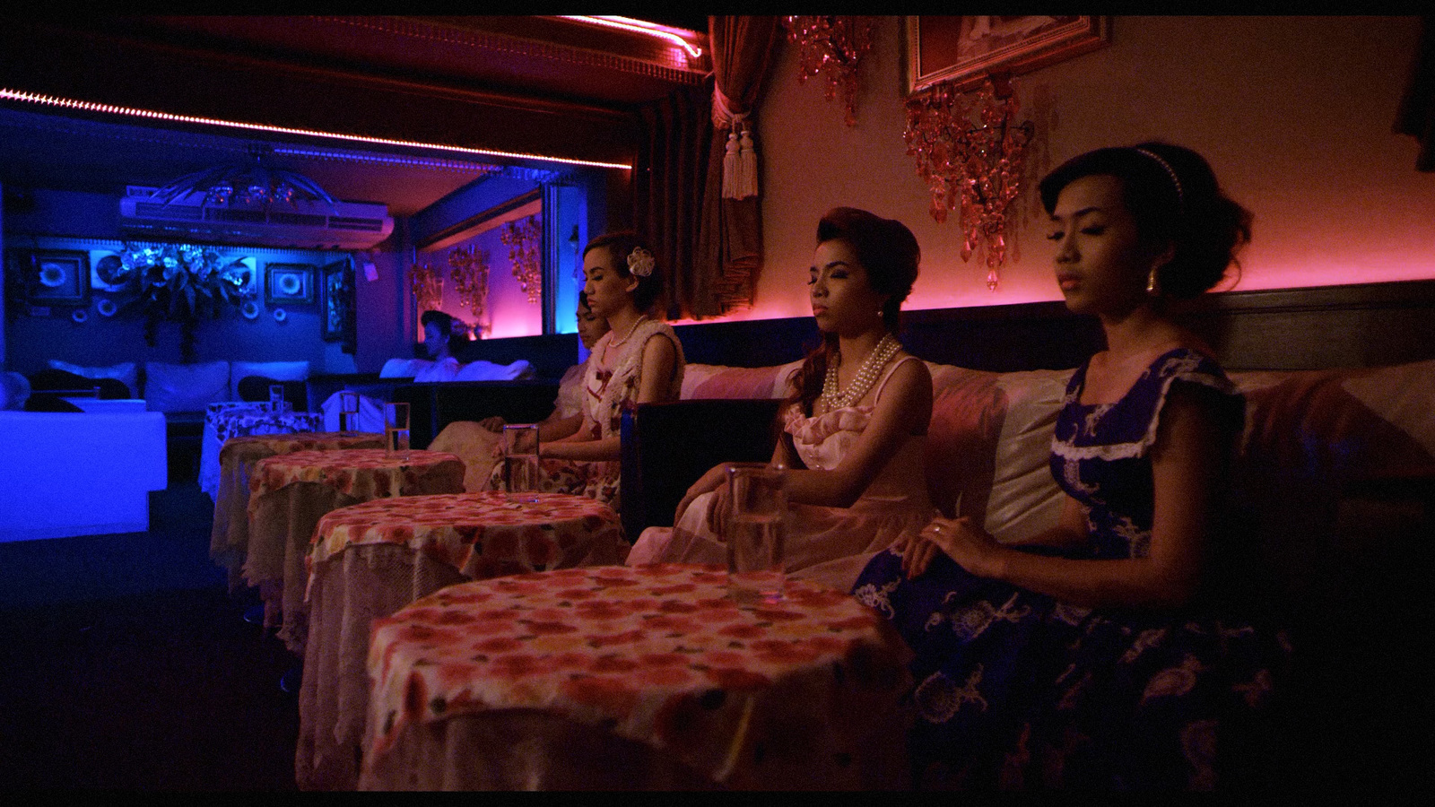 a group of women sitting next to each other at a table