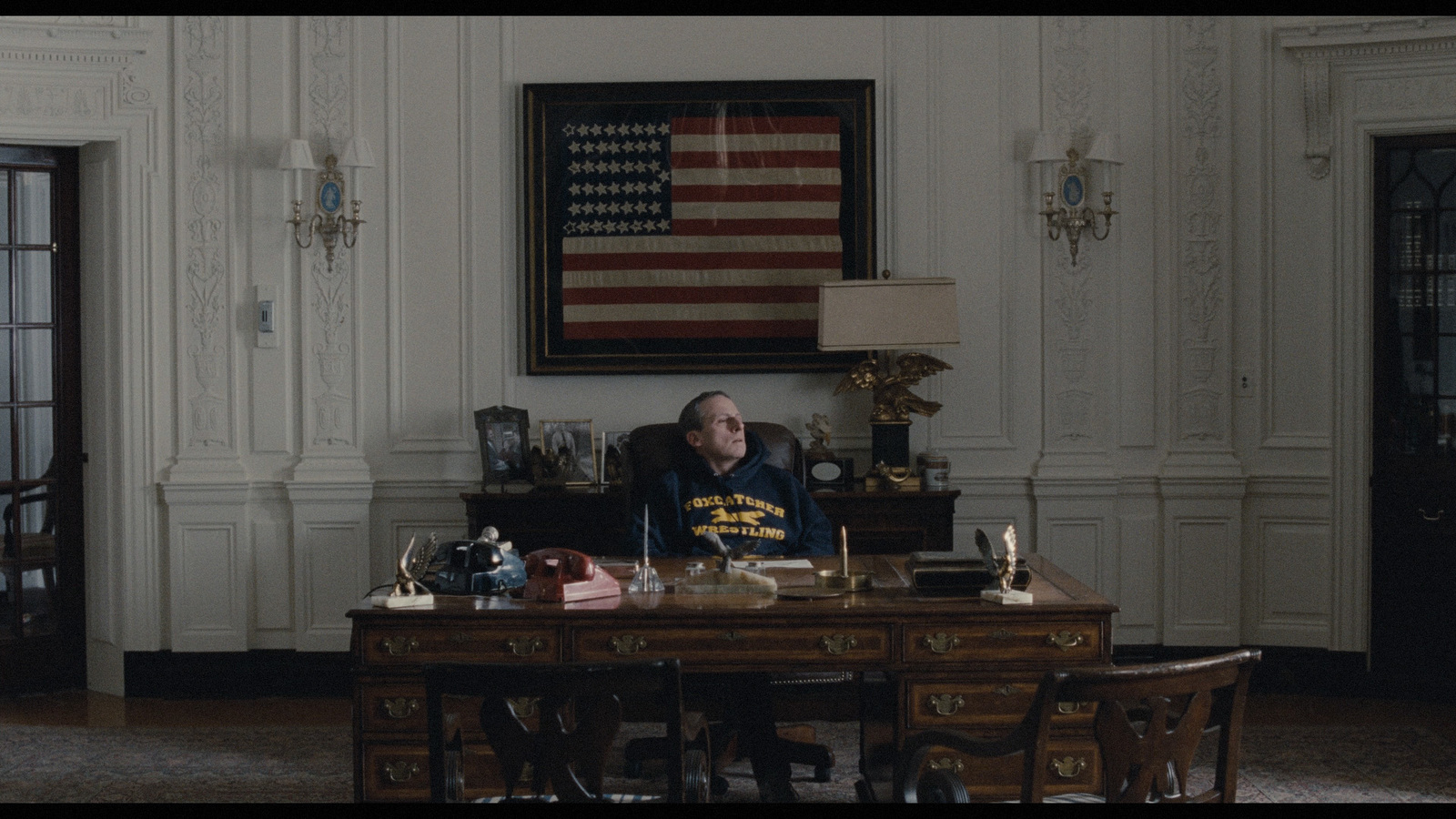 a man sitting at a desk in a room