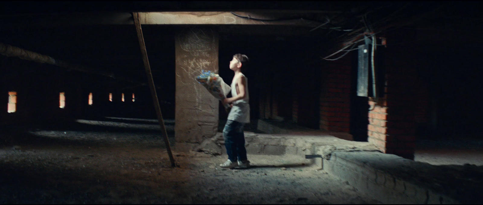 a person standing in a dark room holding something