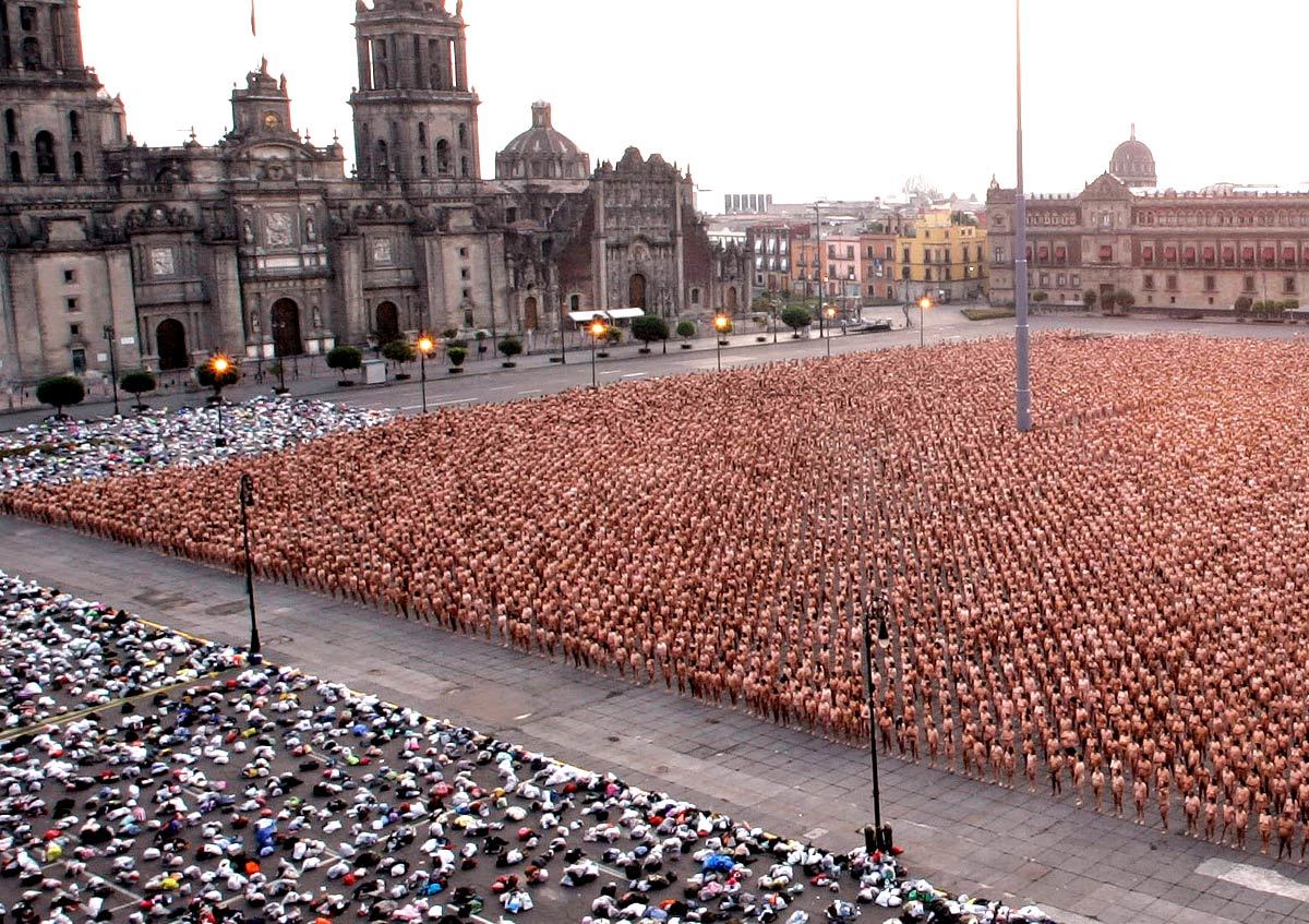 a large crowd of people standing in front of a building