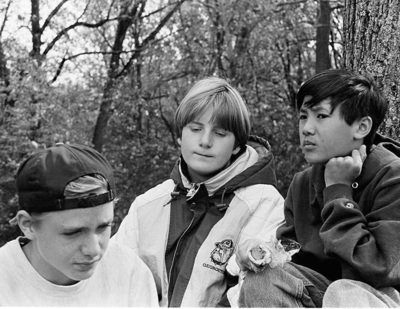 a group of young men sitting next to each other