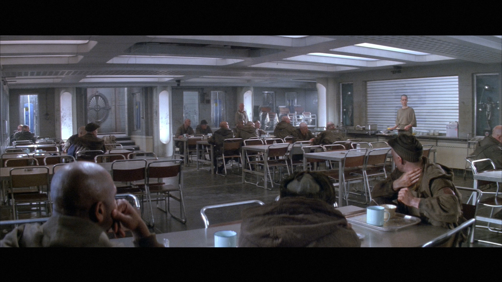 a group of people sitting at tables in a room